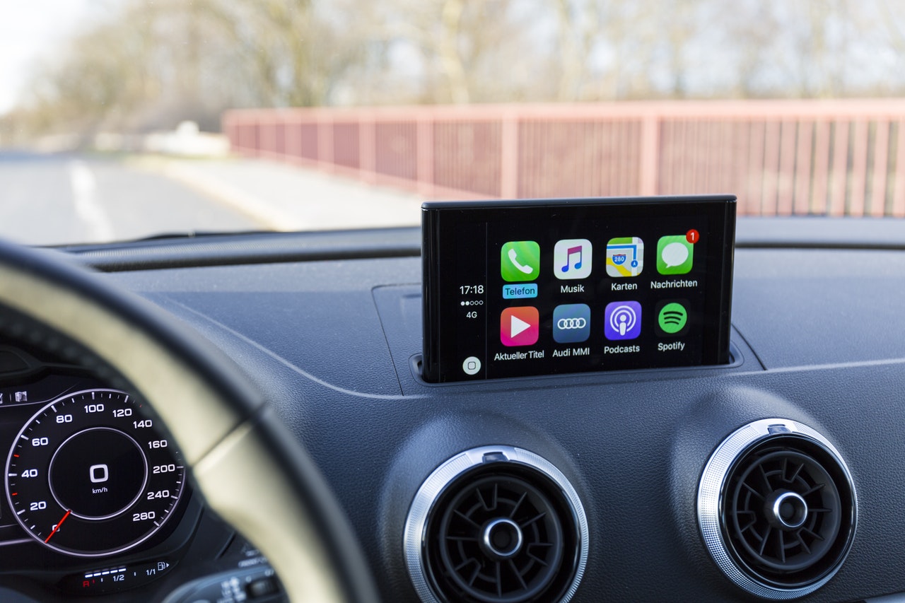 Man is using a carplay in his car